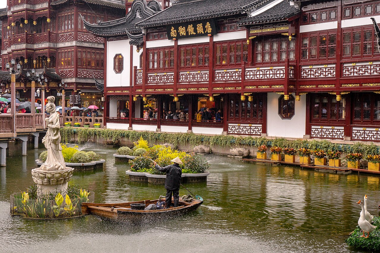 Pond and traditional-style buildings in the commercial area outside Yu Garden