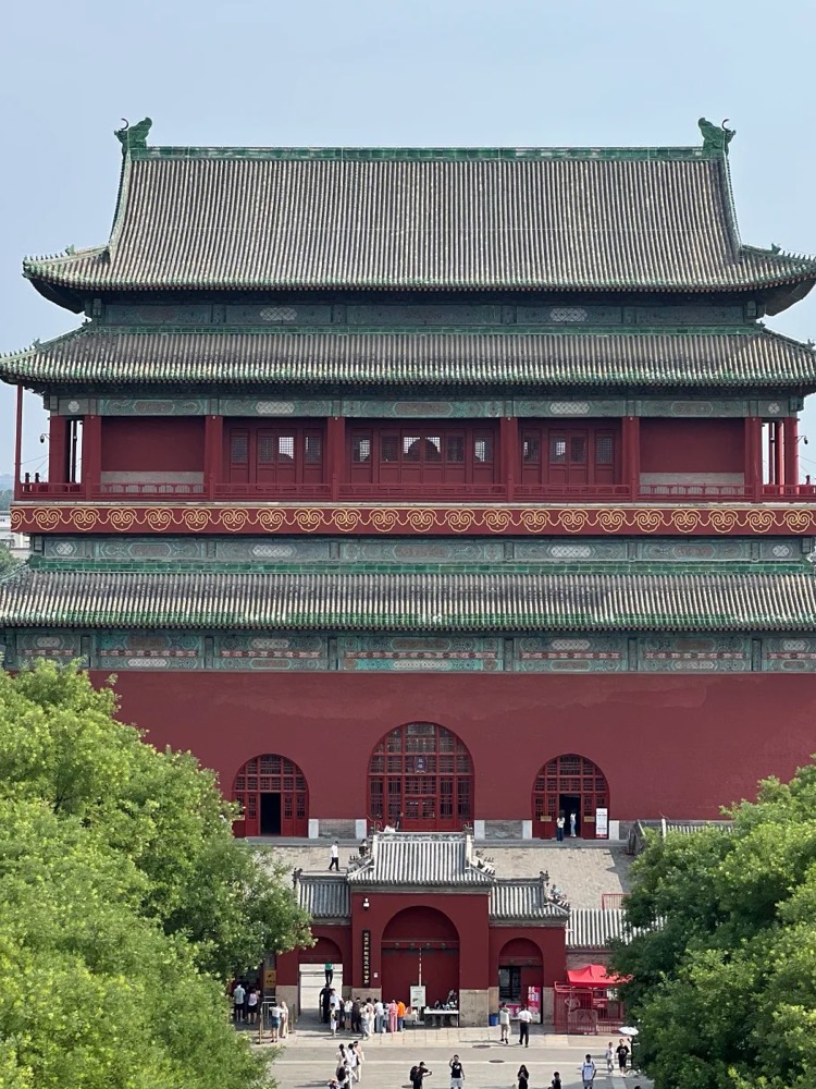 The red Drum Tower rising above trees in Beijing