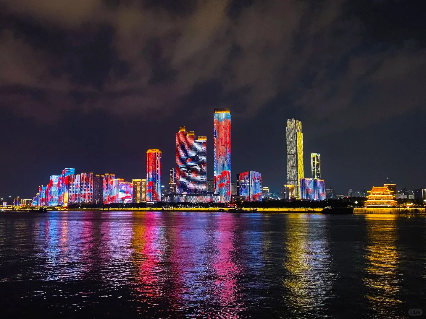 Illuminated Changsha skyline reflected in the Xiang River at night