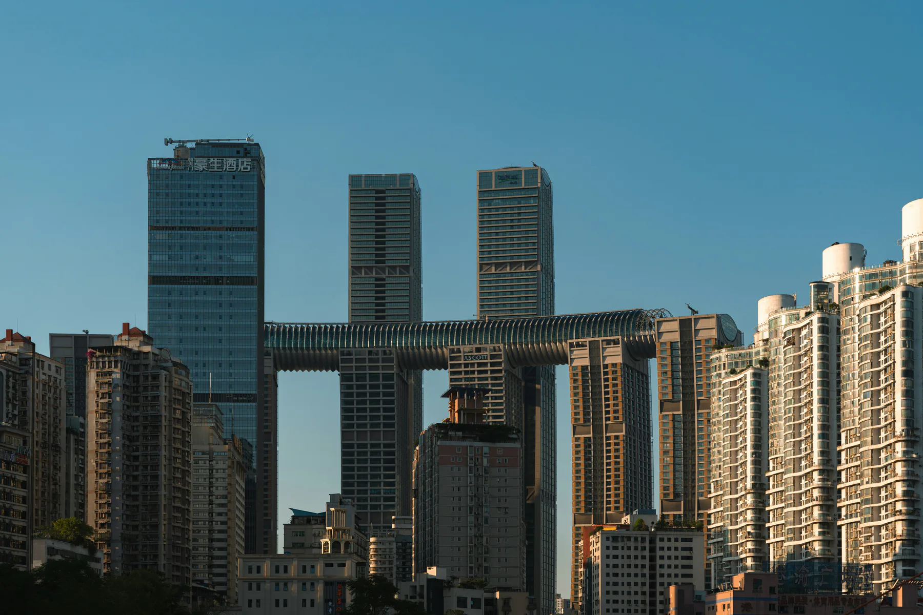 Chongqing skyline with towers connected by the horizontal Raffles City skybridge