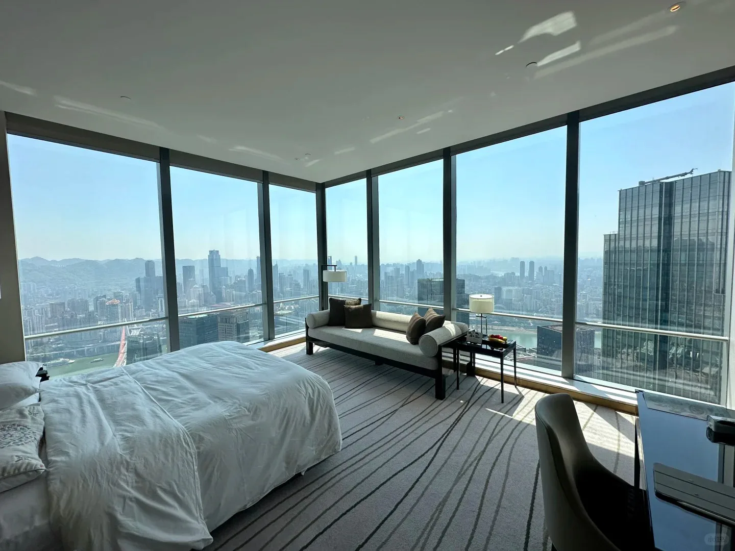 High-floor Chongqing hotel room with corner windows overlooking the city
