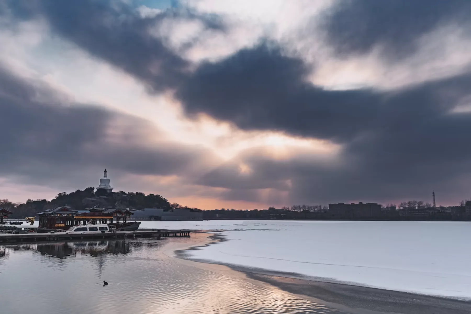 The White Dagoba rises above a frozen lake in Beijing’s Beihai Park during winter.