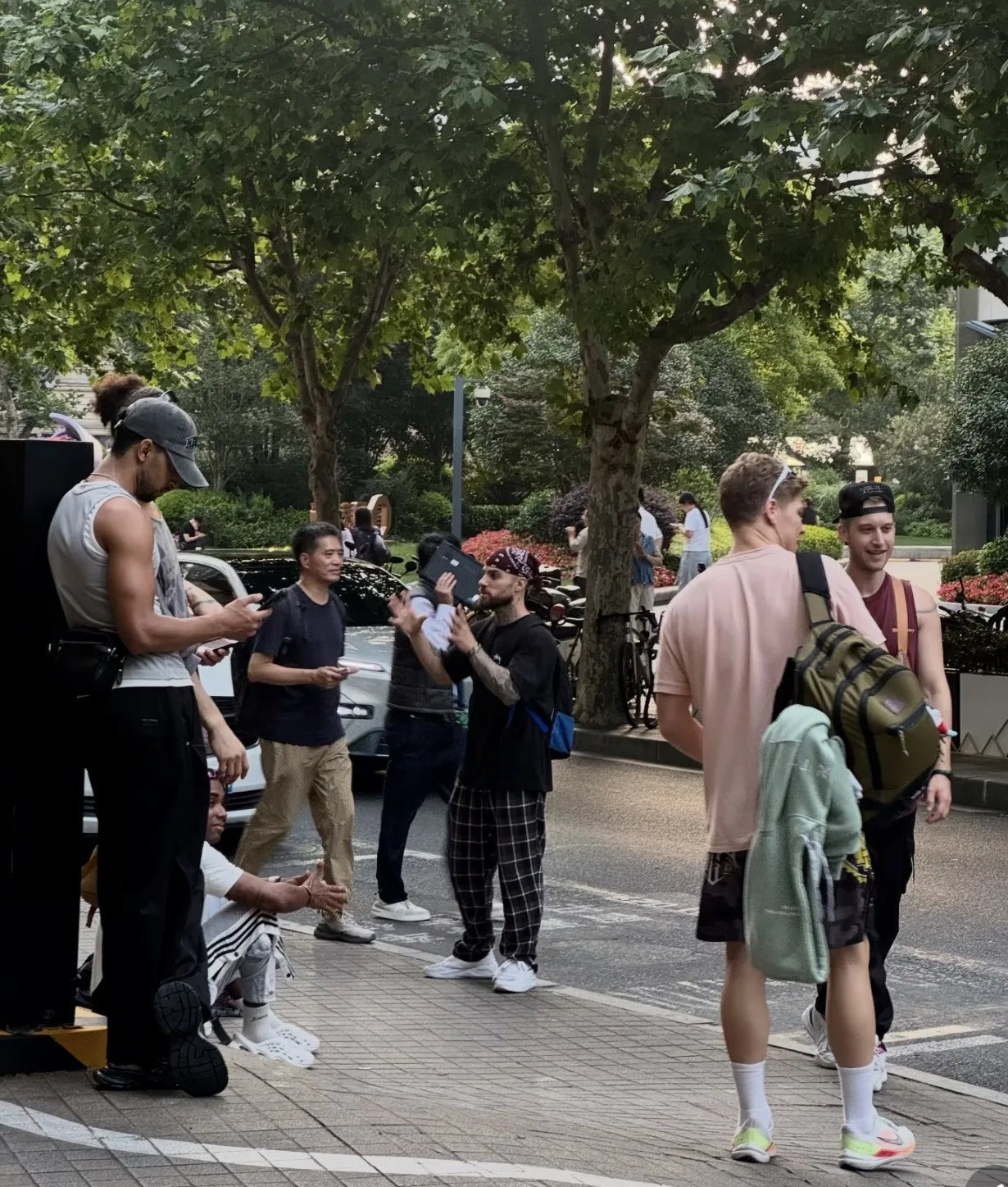 European travelers pausing on a tree-lined street in China