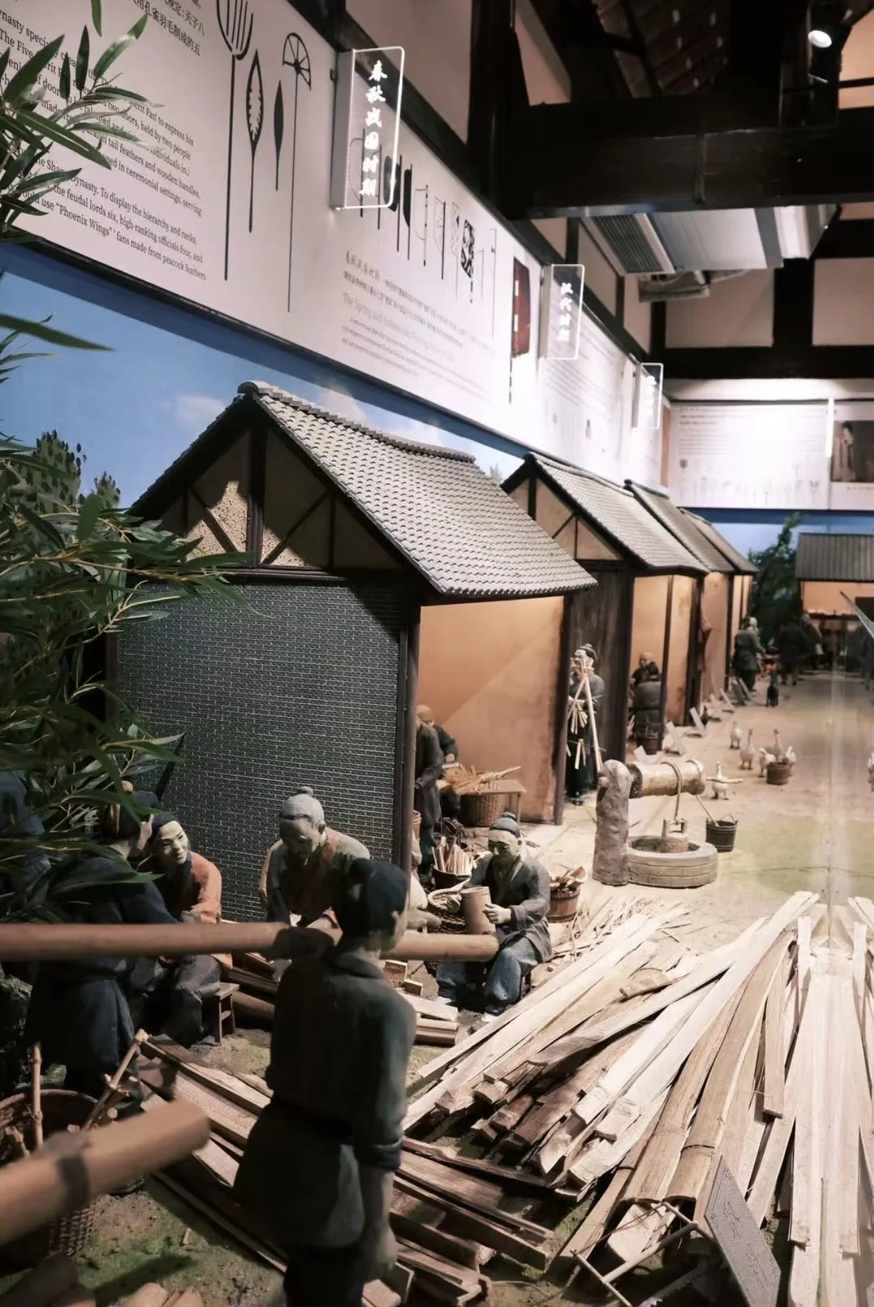 Indoor heritage exhibit showing miniature timber workshops and traditional crafts at Kuanzhai Alley