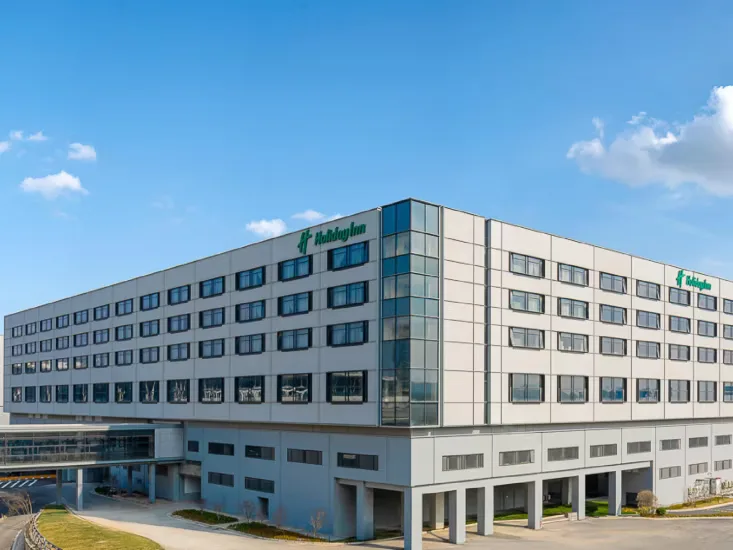 Exterior of Holiday Inn Shanghai Pudong Airport between the airport terminals