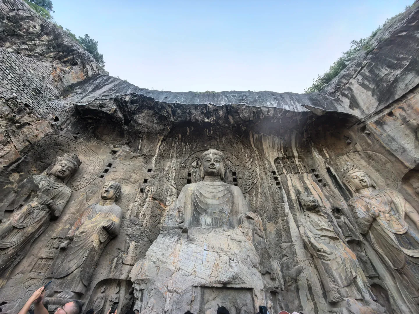 Monumental Buddhist carvings in the rock face at Longmen Grottoes in Luoyang