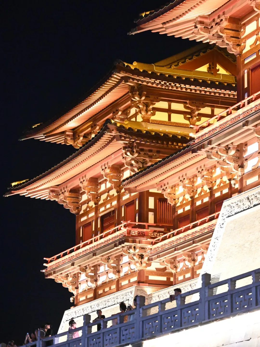 Illuminated timber-style architecture at Yingtian Gate in Luoyang at night