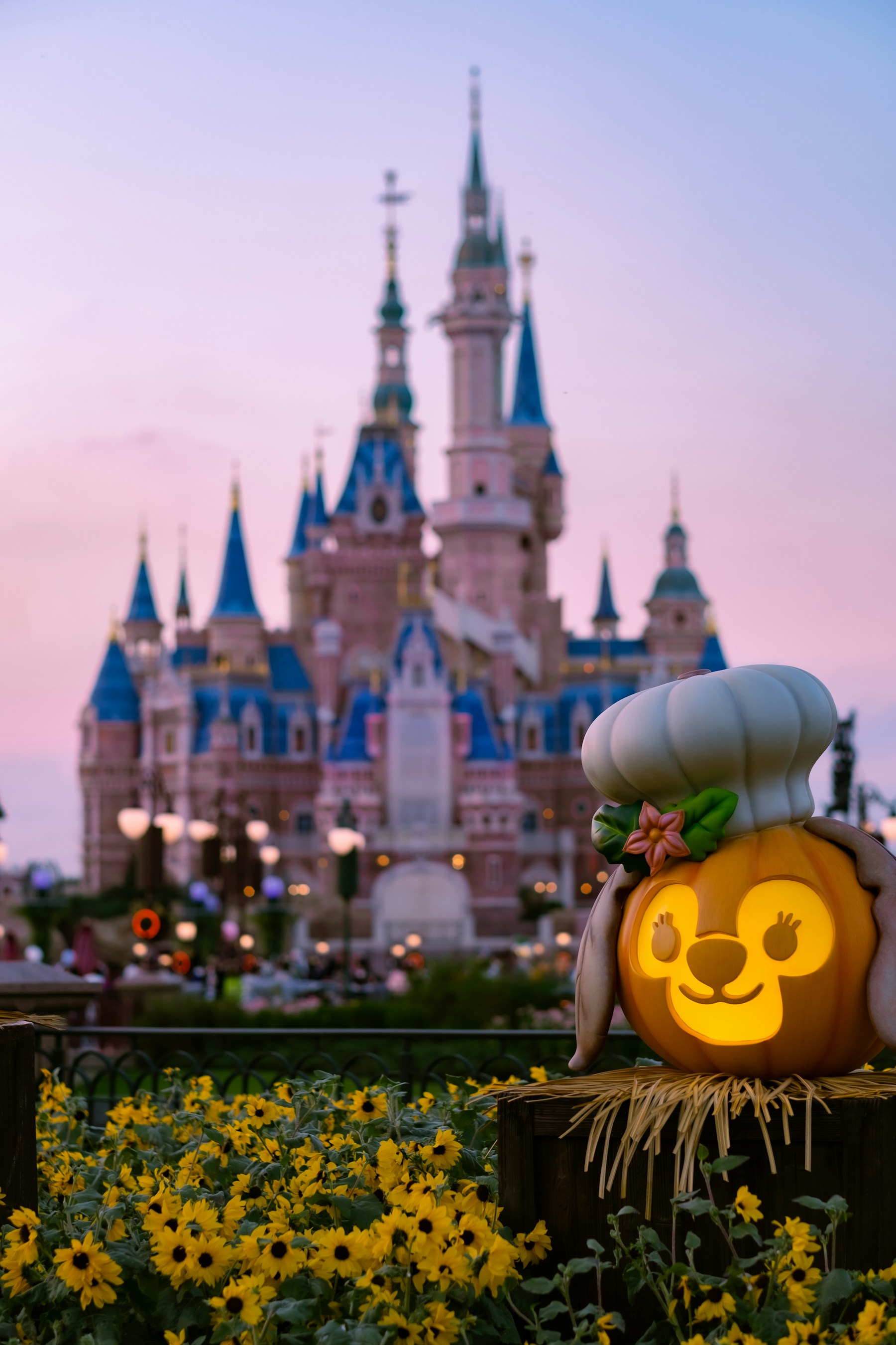 A fairytale castle lit warmly at dusk