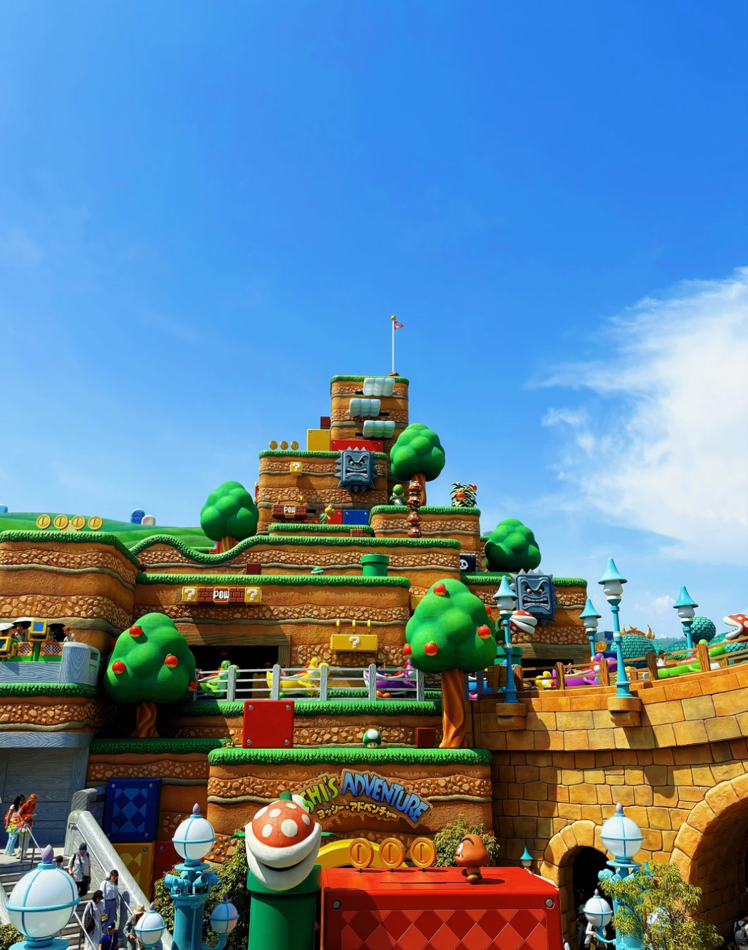 A colorful Super Nintendo themed area under a blue sky