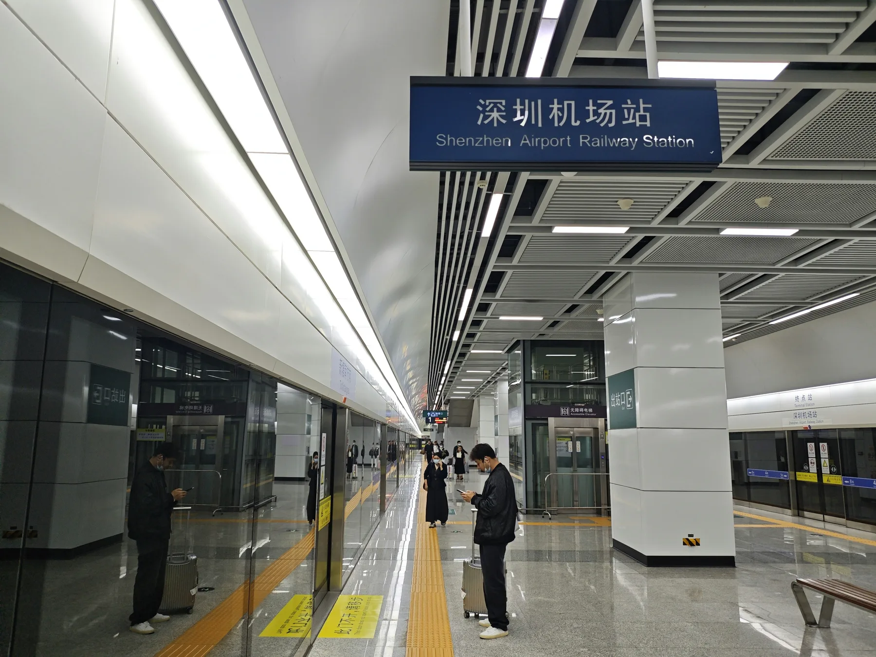 Passengers waiting on the railway platform at Shenzhen Airport